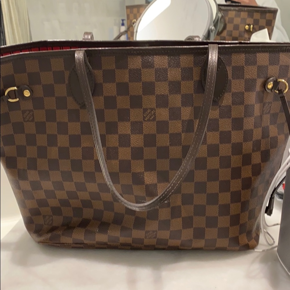 Louis Vuitton never full with pouch